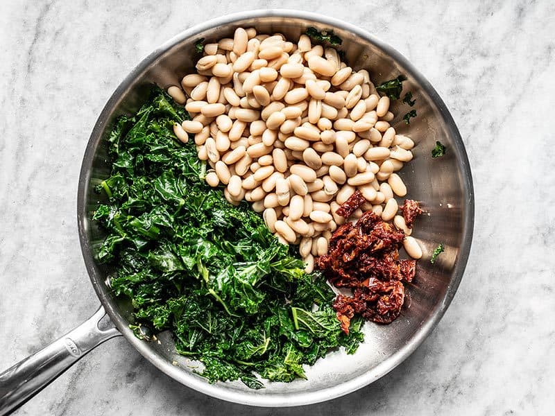 Add Cannellini Beans and Sun Dried Tomatoes to Skillet