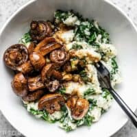 Close up of a bowl of Balsamic Roasted Mushrooms with Herby Kale Mashed Potatoes