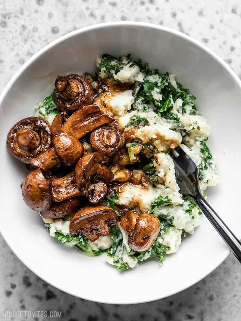 A bowl full of Balsamic Roasted Mushrooms with Herby Kale Mashed Potatoes