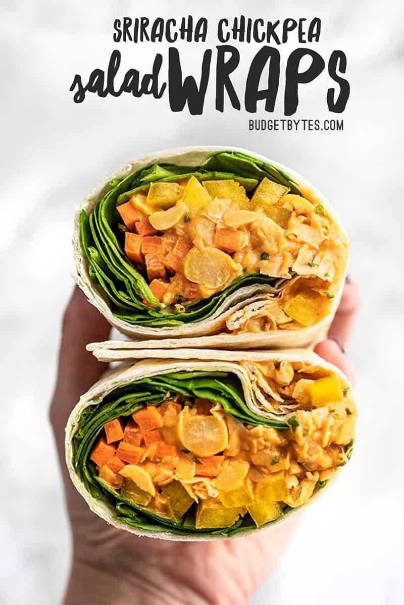 A Sriracha Chickpea Salad Wrap cut open, with open sides facing viewer.