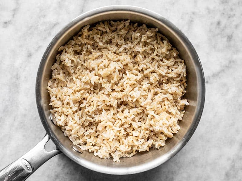 Cooked and fluffed Rice in the sauce pot