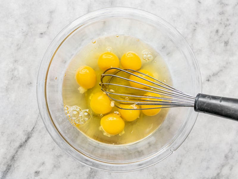 Eight Eggs in a Bowl with a Whisk