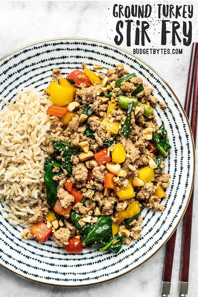 A patterned plate full of Ground Turkey Stir Fry and Brown Rice