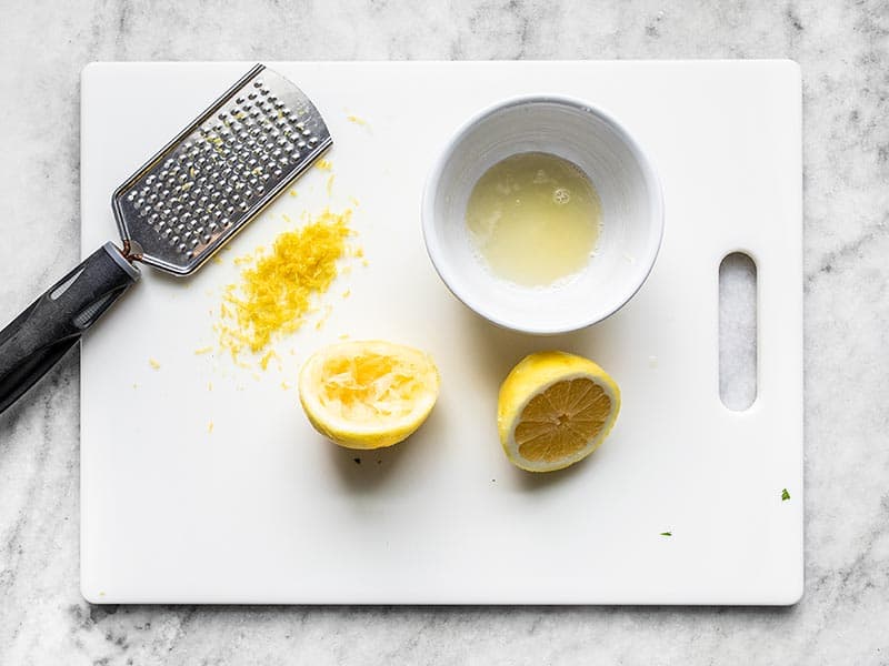 Juiced and Zested lemon on a cutting board