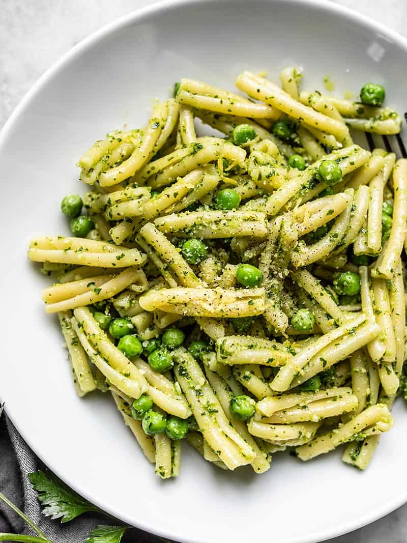 Close up of Parsley Pesto Pasta with Peas in a serving bowl