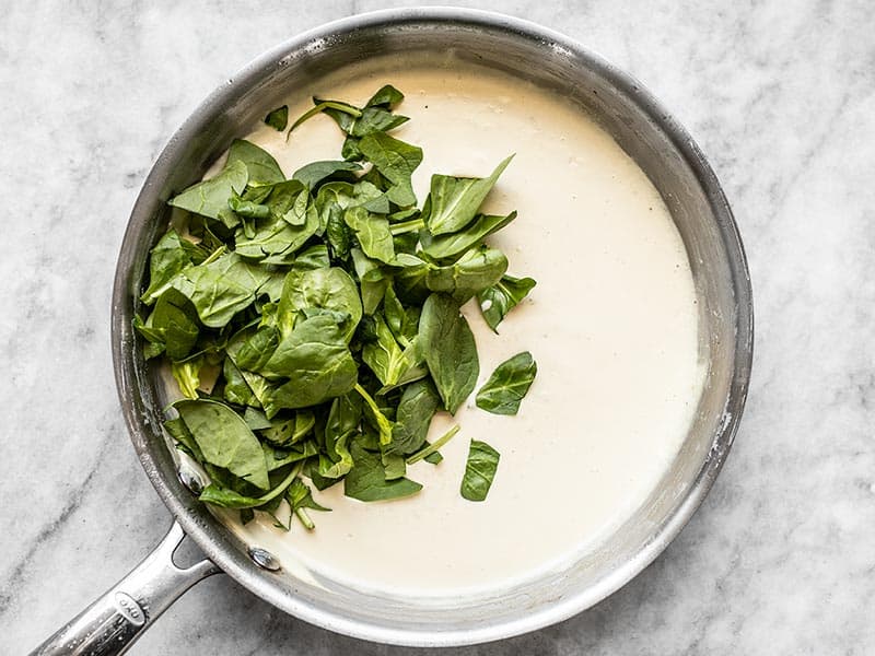 Add Chopped Spinach to the garlic parmesan cream sauce