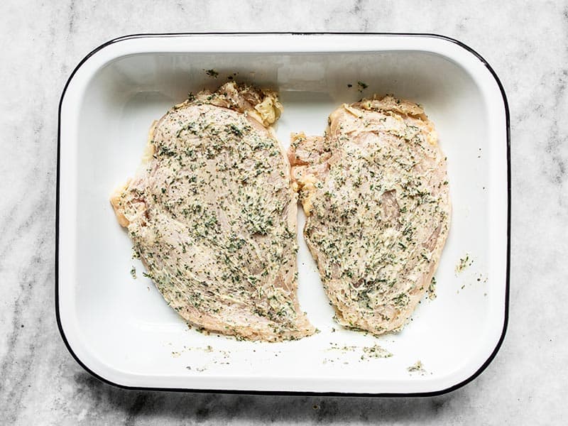 Garlic Herb Chicken Breast in a baking dish ready to go into the oven.