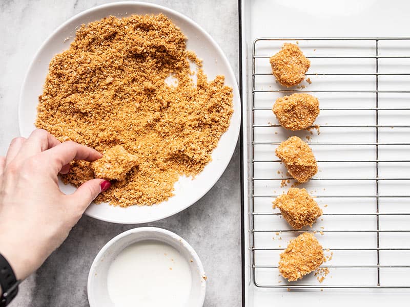 Dip Chicken in breading mixture then place on wire rack. 