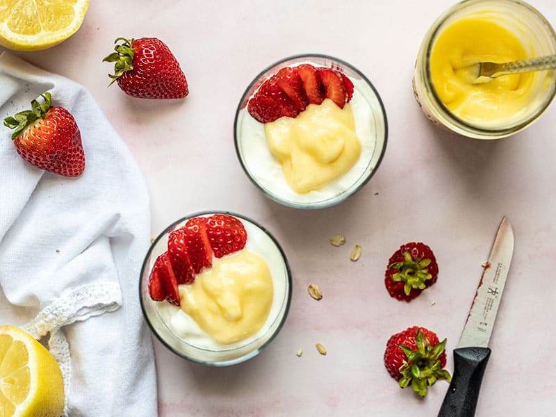 Lemon curd and sliced strawberries added to each glass.