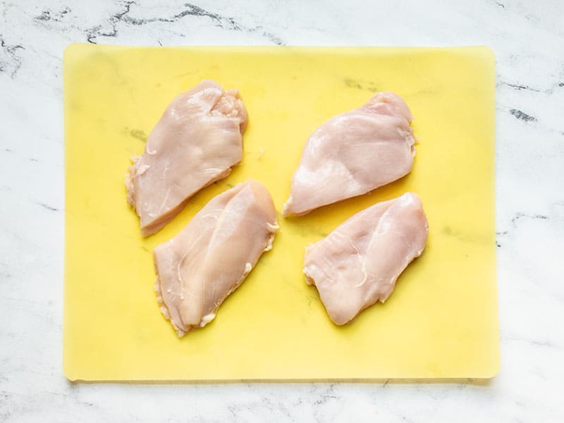 Chicken breasts cut into two pieces