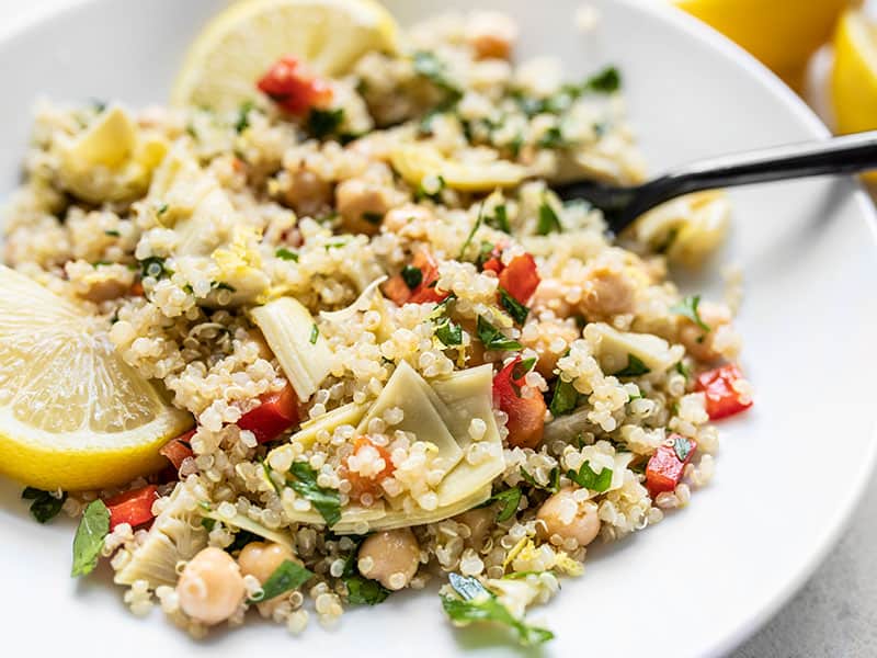 Close up side view of Lemony Artichoke and Quinoa Salad in a bowl