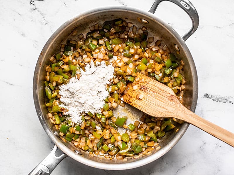 Flour added to skillet with onion and bell pepper