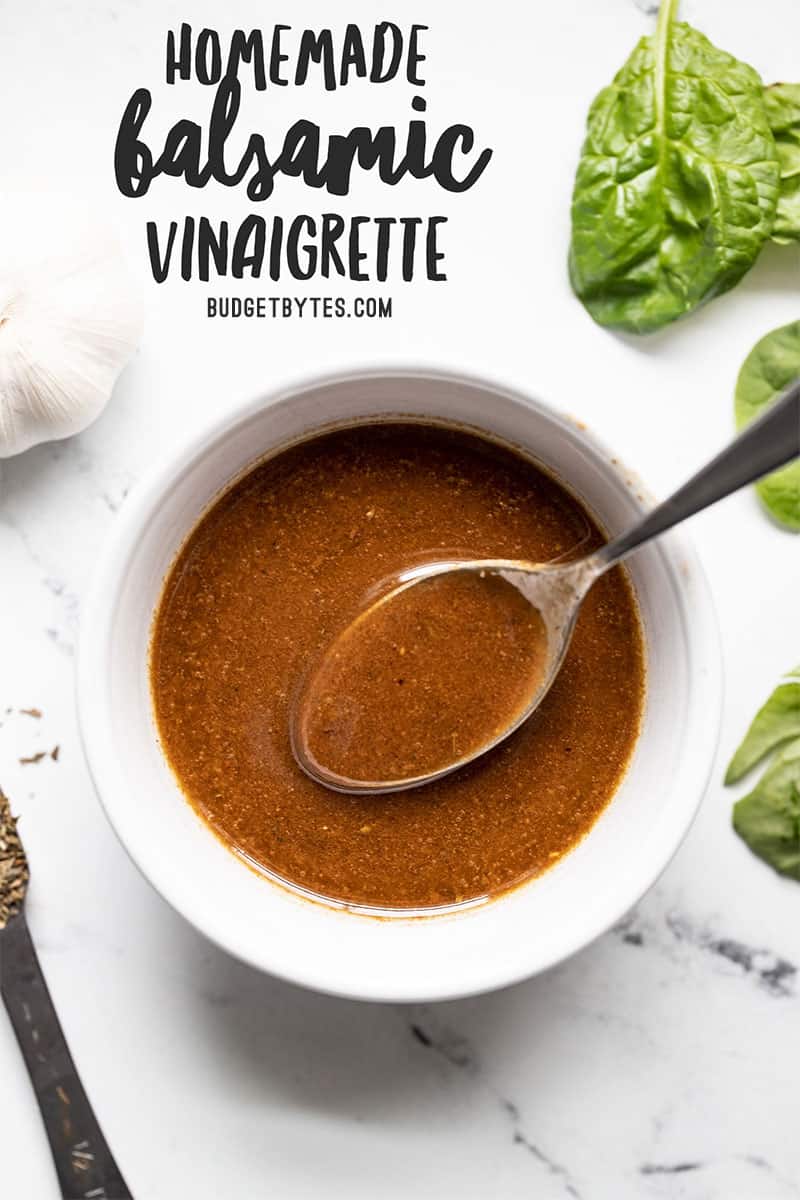 homemade balsamic vinaigrette in a small white bowl with a spoon, title text at the top