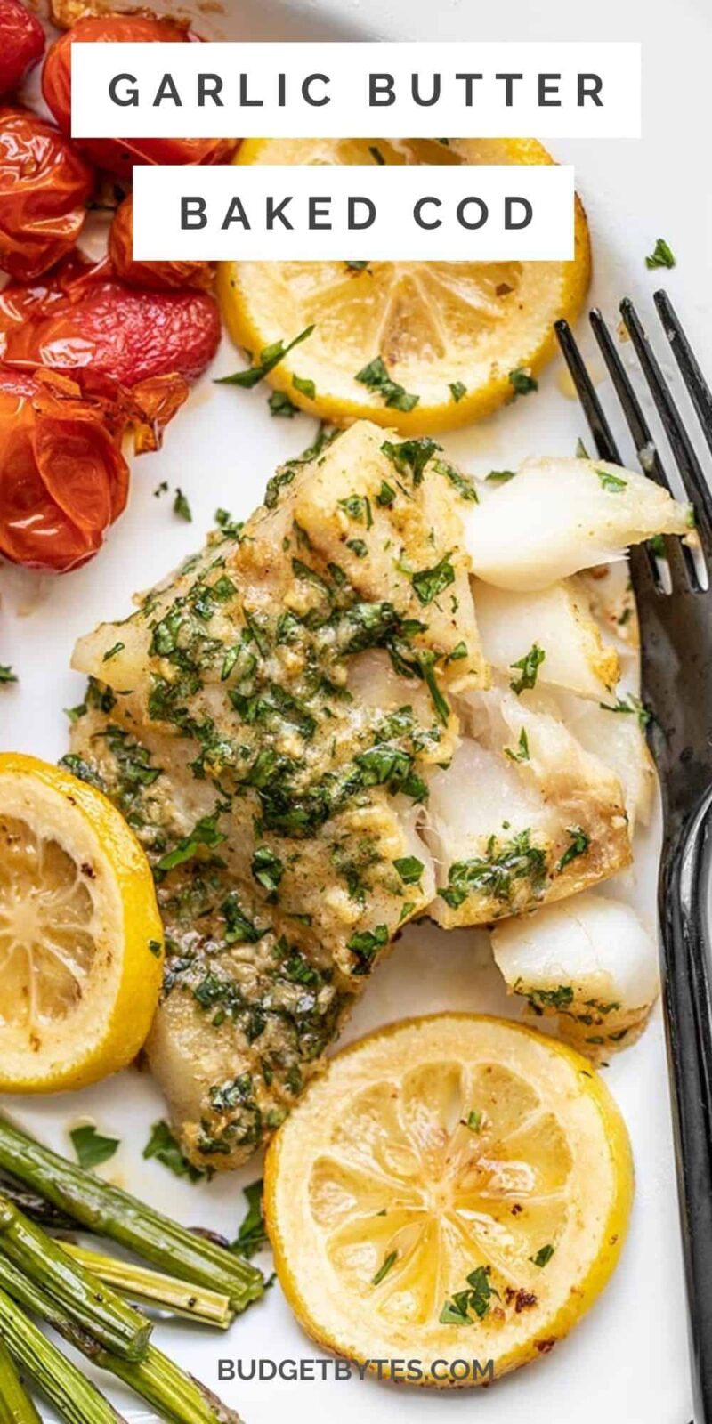 Close up of garlic butter baked cod on a plate, title text at the top