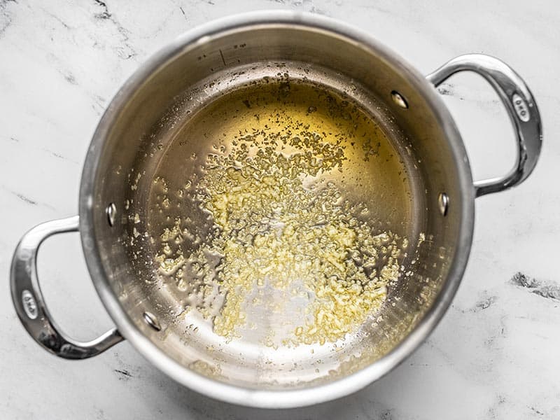 Minced garlic and olive oil in a soup pot