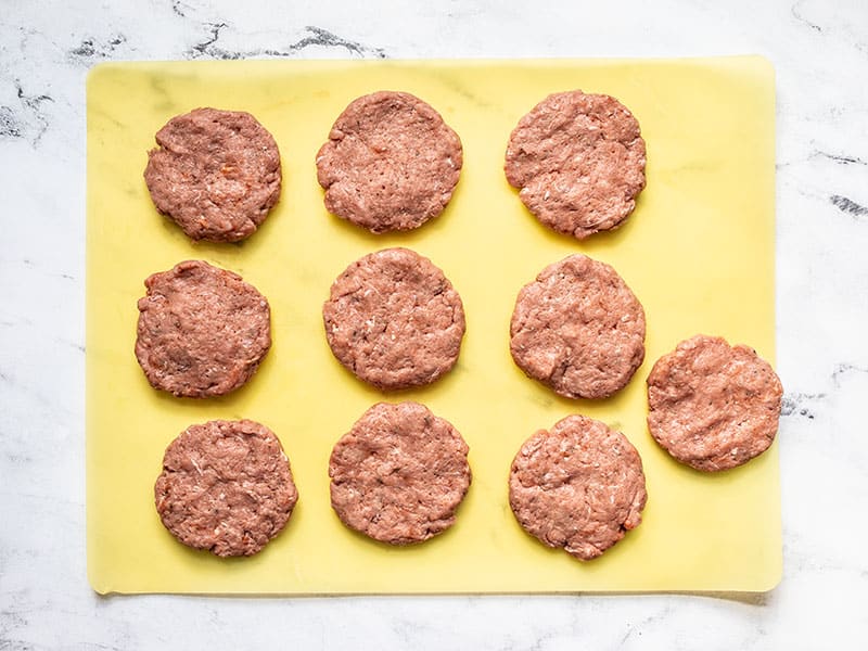 shaped maple sage breakfast sausages on a cutting board