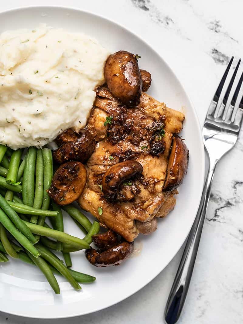 Balsamic Chicken and Mushrooms on a plate with mashed potatoes and green beans
