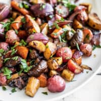 Close up of Balsamic Roasted Vegetables on a white platter