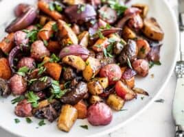 Close up of Balsamic Roasted Vegetables on a white platter