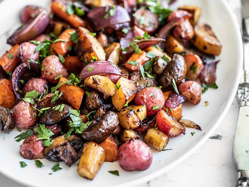 Close up of Balsamic Roasted Vegetables on a white platter