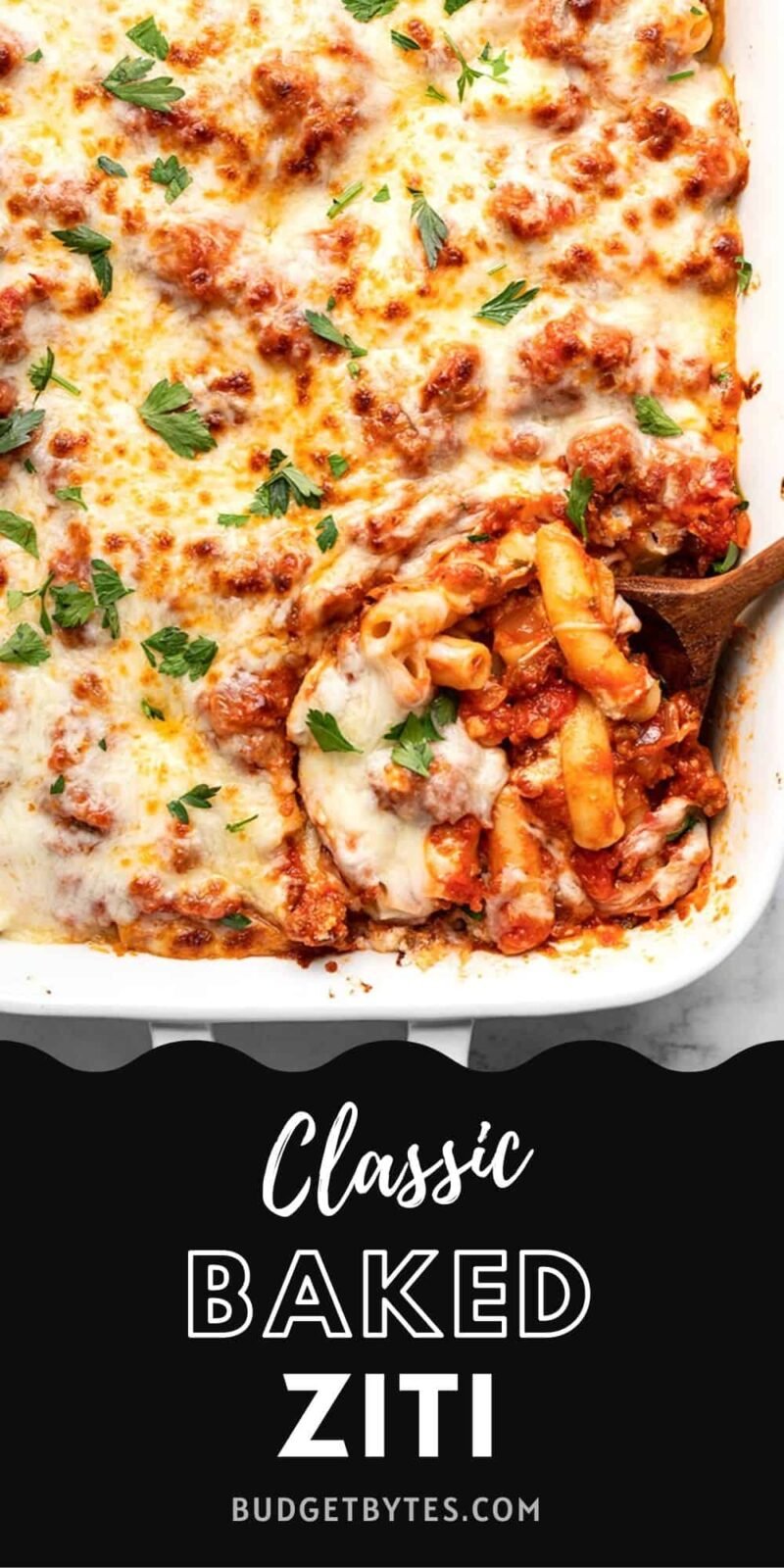 Overhead view of classic baked ziti with spoon, title text at the bottom