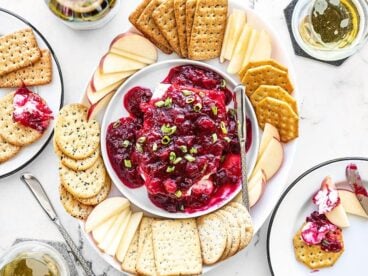 Cranberry Cream Cheese Dip platter with crackers and apple slices