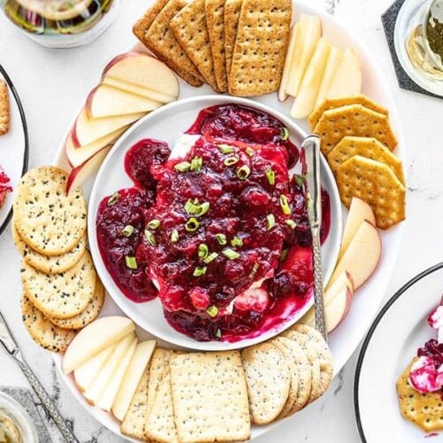 Cranberry Cream Cheese Dip platter with crackers and apple slices
