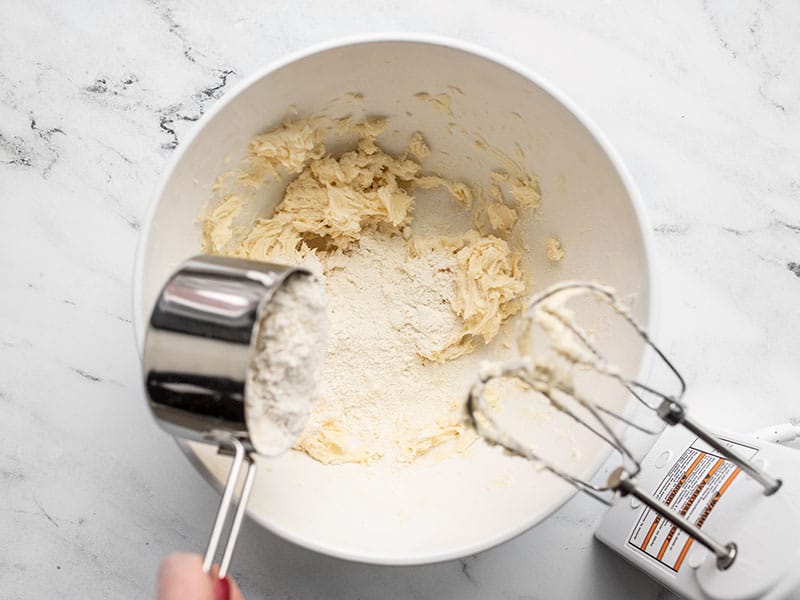 Beat flour into butter and sugar