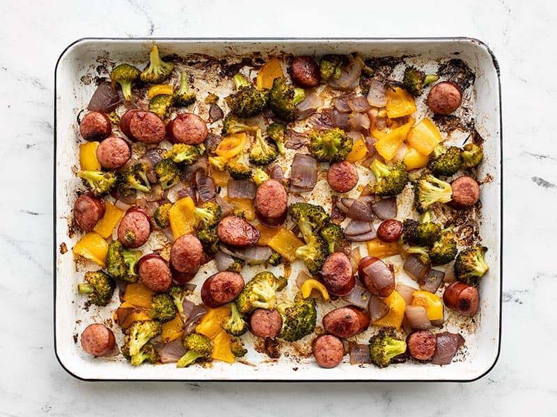 Roasted sausage and vegetables on the baking sheet