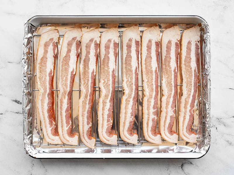 Bacon arranged on top of wire rack
