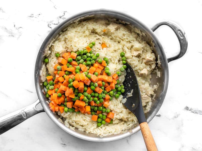 Frozen vegetables added to the skillet