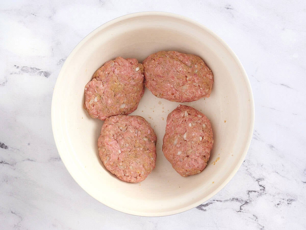 Salisbury steak patties in a bowl.