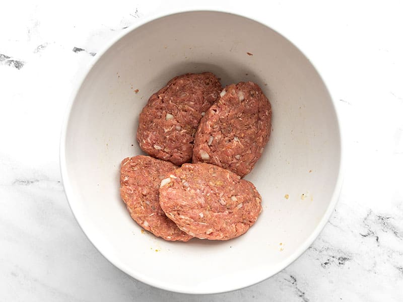 Shaped Salisbury Steak patties in a bowl