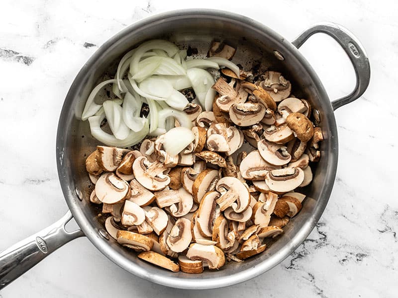 Onions and Mushrooms added to the skillet