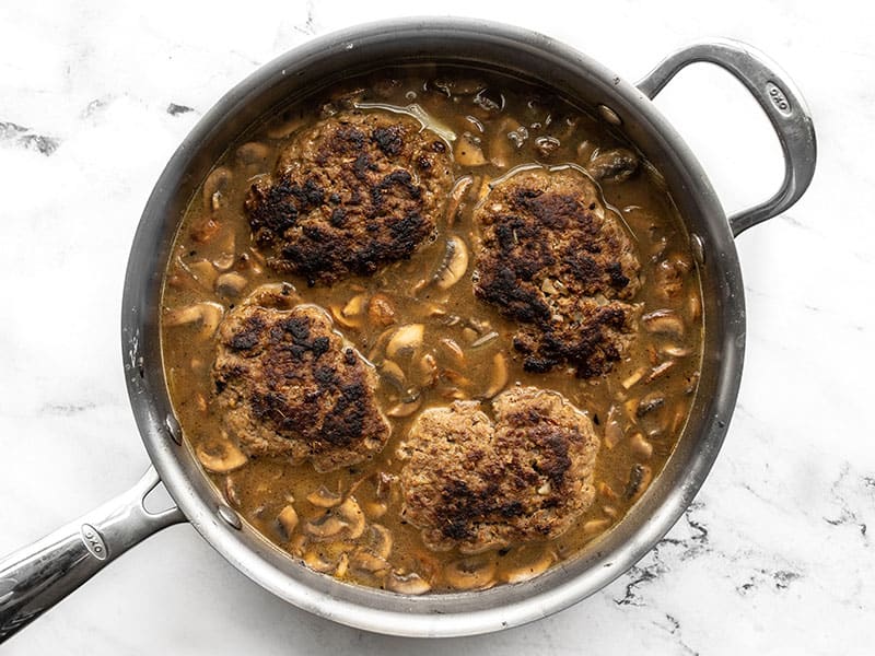 Beef patties returned to gravy in the skillet