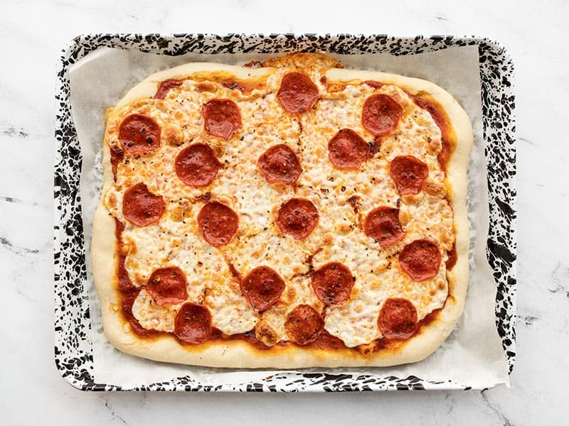 Baked pepperoni pizza on sheet pan