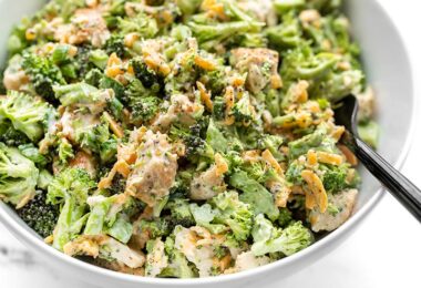 Close up side view of a bowl of Broccoli Cheddar Chicken Salad