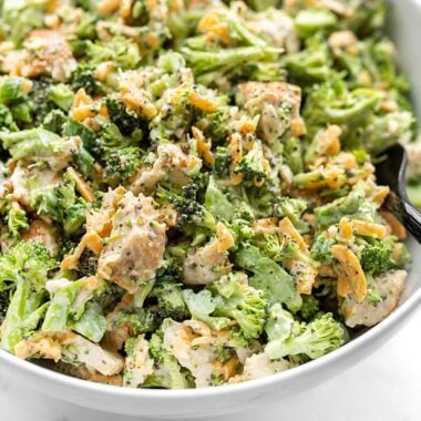 Close up side view of a bowl of Broccoli Cheddar Chicken Salad