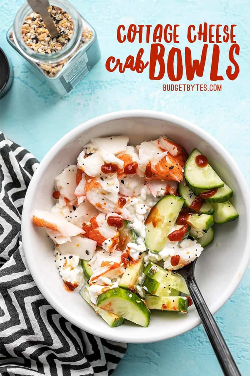 Close up of a cottage cheese crab bowl with a fork in the side, title text at the top