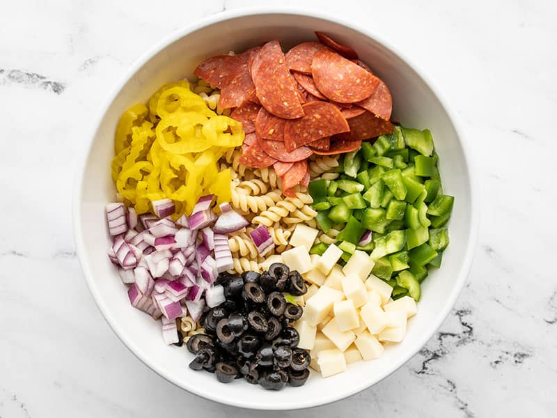 Pasta salad ingredients in a bowl