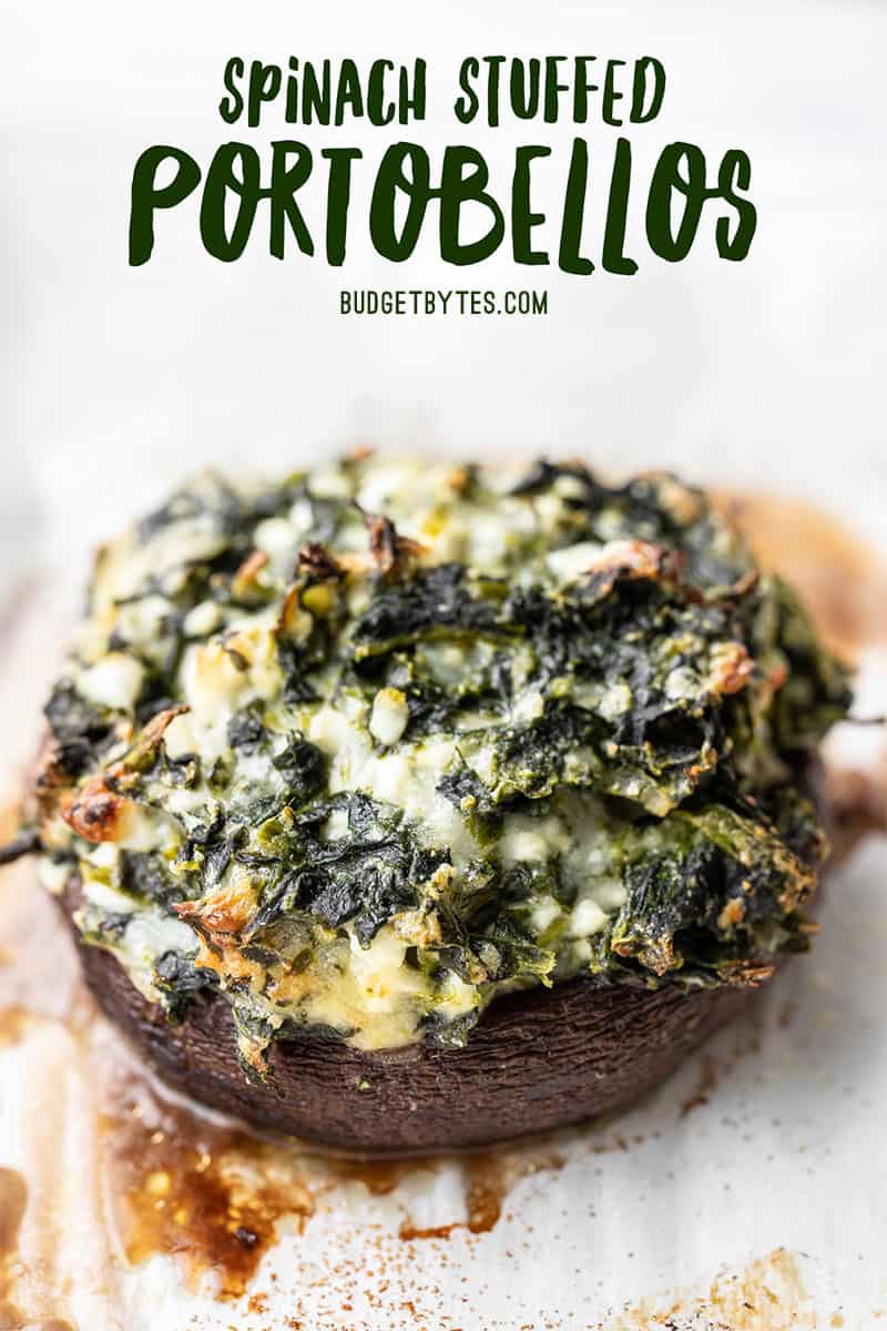 Close up of a spinach stuffed portobello, from the side, just baked.