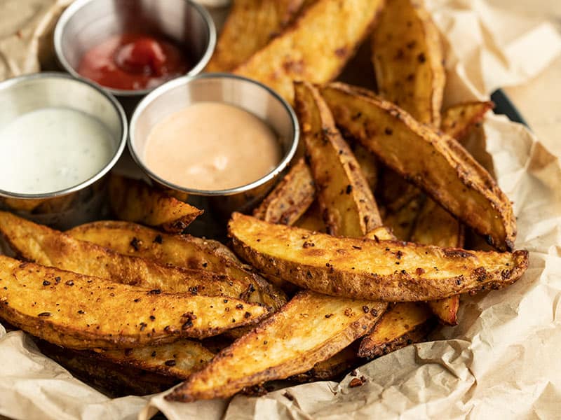 Close up side view of the plate of steak fries