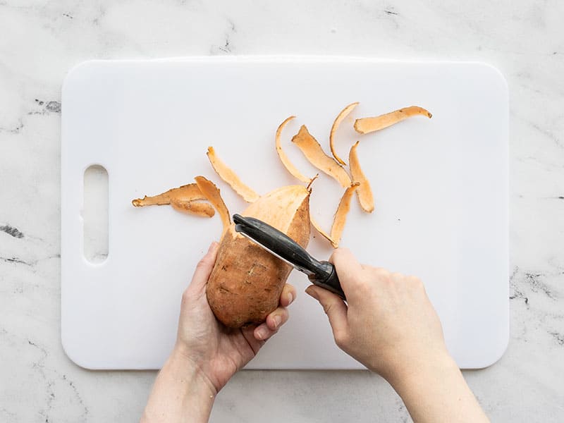 Sweet potato being peeled