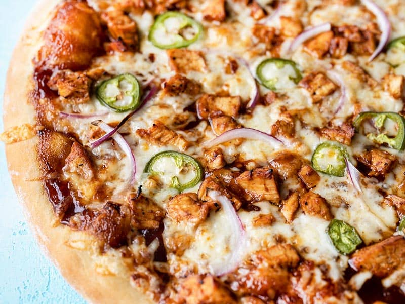 Close up side view of a BBQ Chicken Pizza