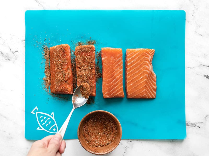 Season salmon filets