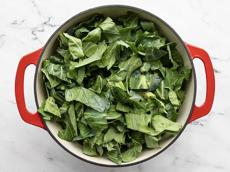 Collard greens added to the pot