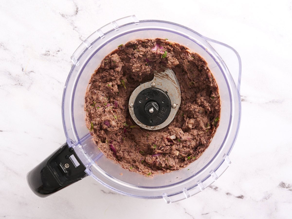 Black bean burger mixture in a food processor.