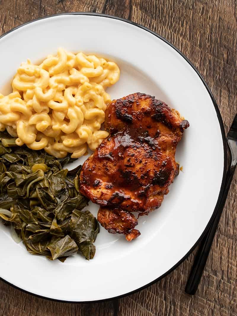 Overhead view of a plate with Quick BBQ Chicken, mac and cheese, and collard greens