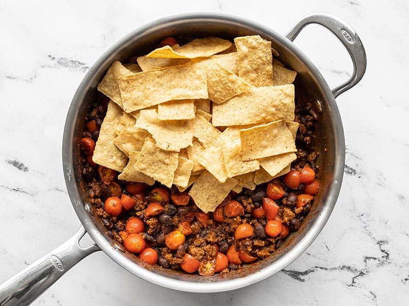 Tortilla chips added to the skillet