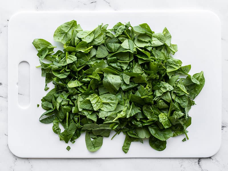 Chopped spinach on a cutting board